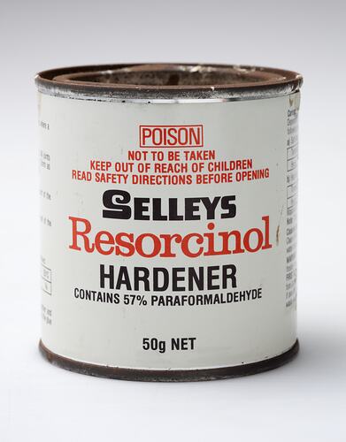 White tin with red and black writing.