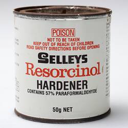 White tin with red and black writing.