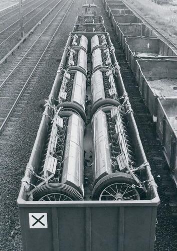 Seed drill heads loaded into railway wagons.