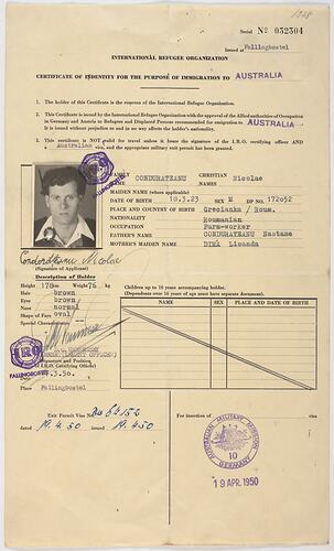Printed form with ID photograph, stamps.