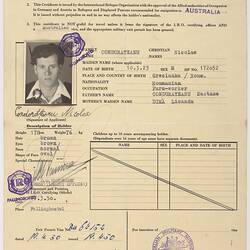 Printed form with ID photograph, stamps.