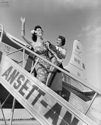 Negative - Ansett-ANA, Woman Disembarking Aeroplane, Essendon Airport, Victoria, 1958