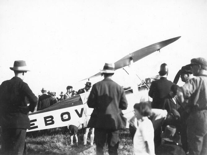 [A crowd gathered around Bert Hinkler's aircraft, 1928. Hinkler made the first solo flight from England to Australia.]