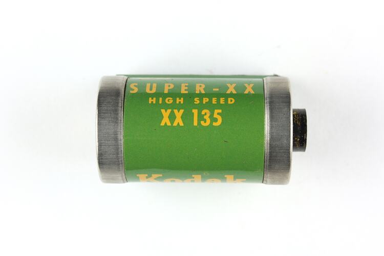 Cylindrical cartridge with green, pressed metal label.