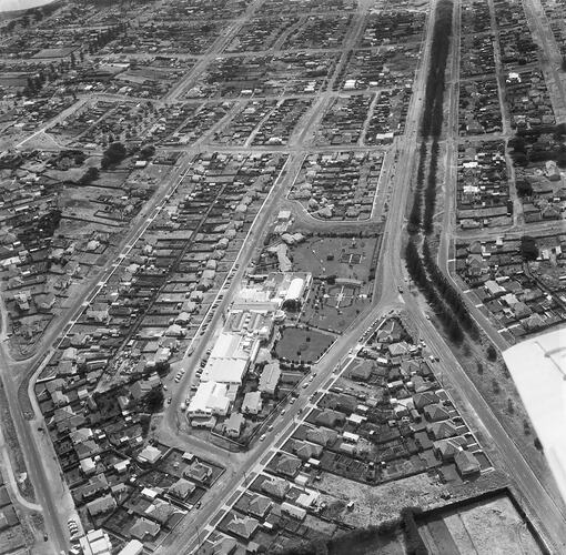 Monochrome aerial image of a factory.