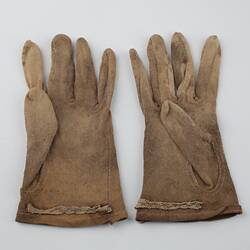 Pair of mid-brown cotton gloves, side by side