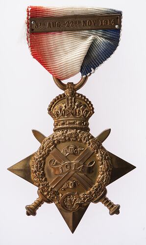Front of bronze four point star medal 'ensigned' by a crown. Red, white and blue ribbon with bronze bar.