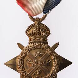 Front of bronze four point star medal 'ensigned' by a crown. Red, white and blue ribbon with bronze bar.